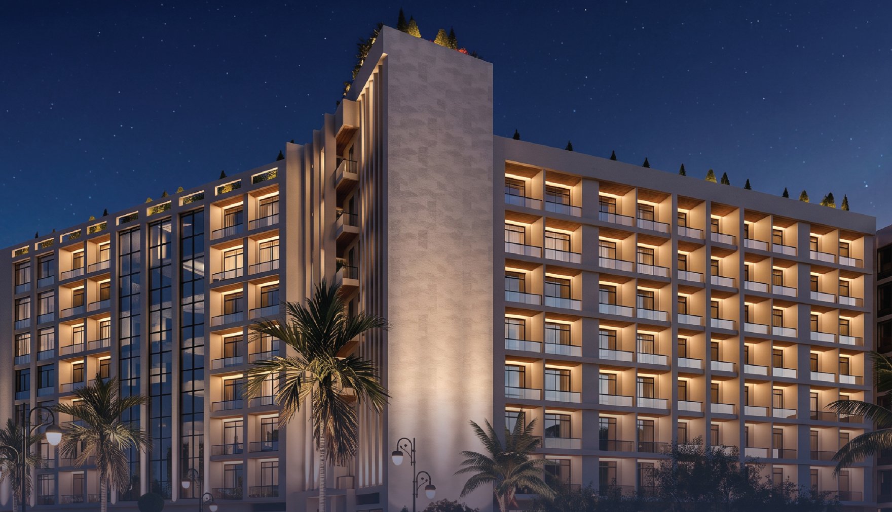 Dar Muscat Hills apartment building at night
