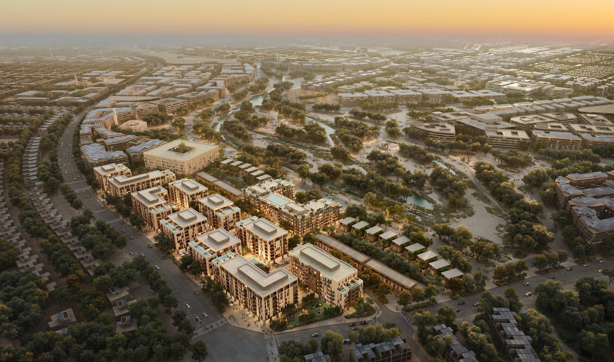 Aerial of Wadi Zaha apartments and the wadi in Sultan Haitham City